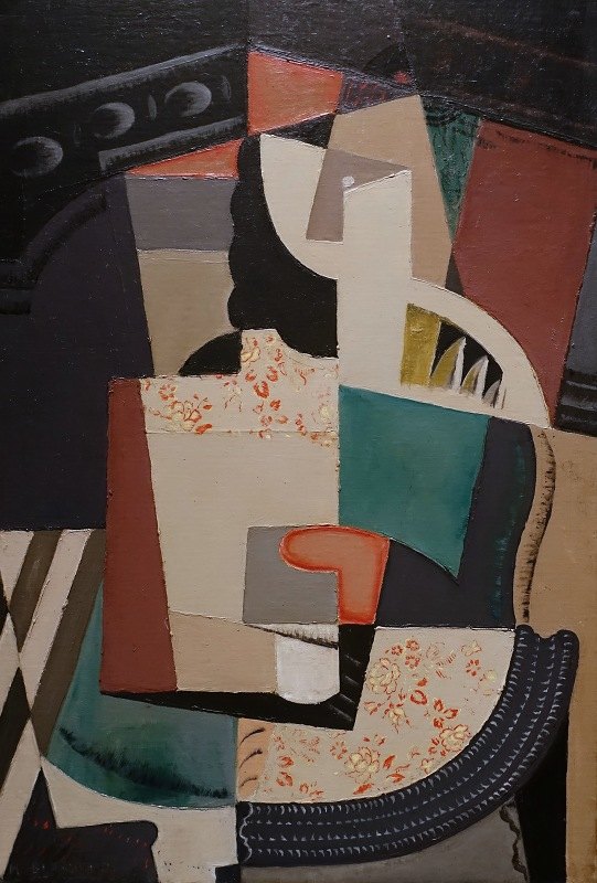女人坐在（坐着的女人）`
Femme Assise (Seated Woman) (c. 1917)  by María Blanchard